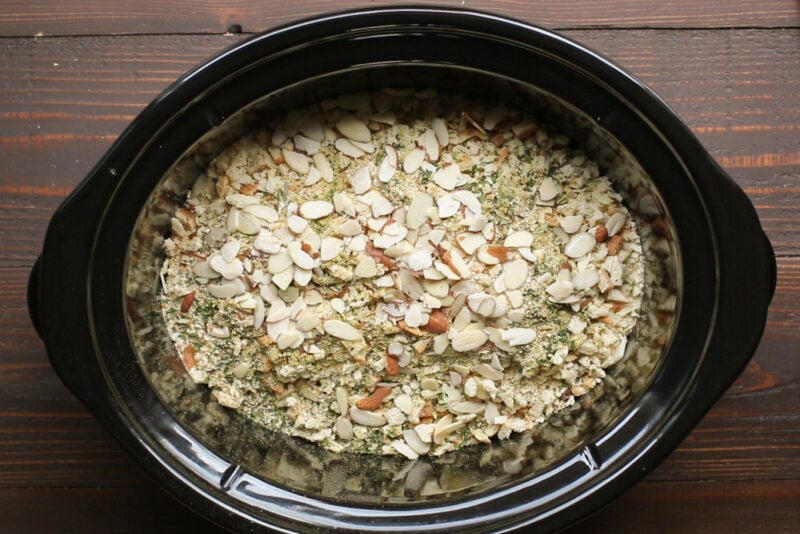 stuffing and almonds on top of a casserole