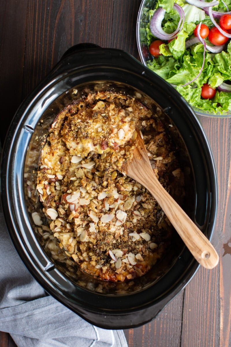 pork chops with stuffing and almonds on top.