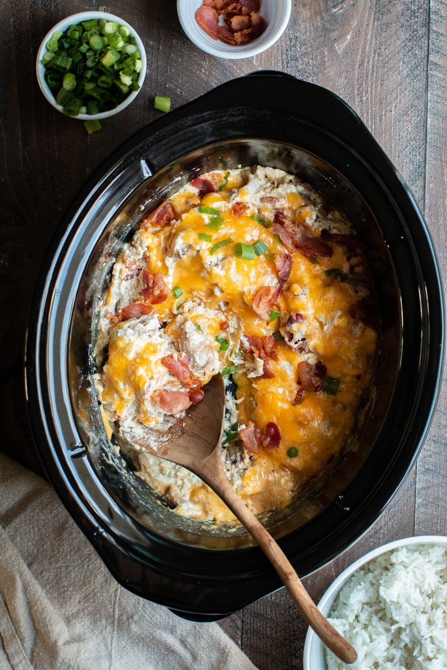 shredded creamy chicken with bacon and cheese on top.