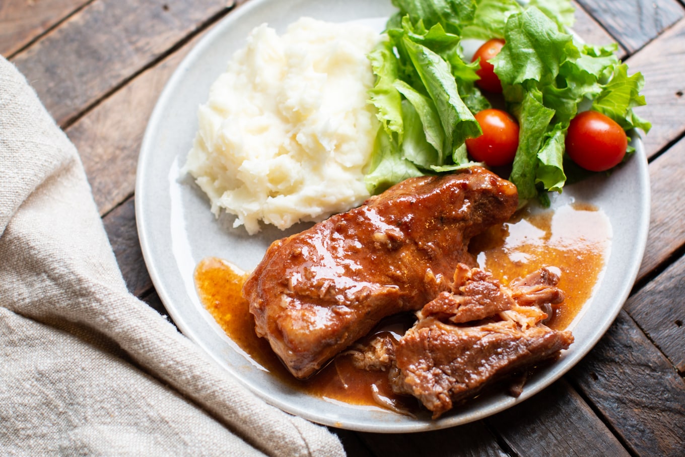 sweet and sour ribs with mashed potatoes and green salad.