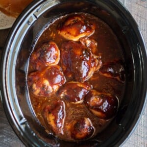chicken thighs in root beer barbecue sauce in slow cooker.