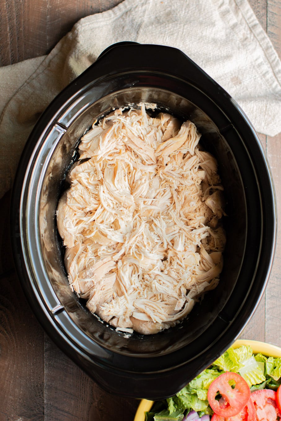 shredded chicken in the slow cooker with a green salad on the side.