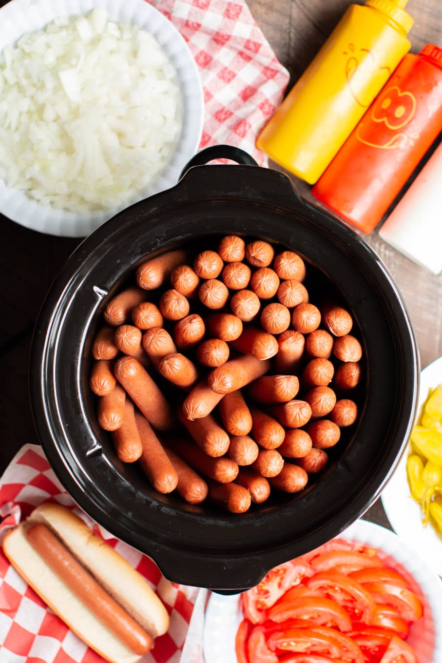 cooked hot dogs in a round slow cooker.