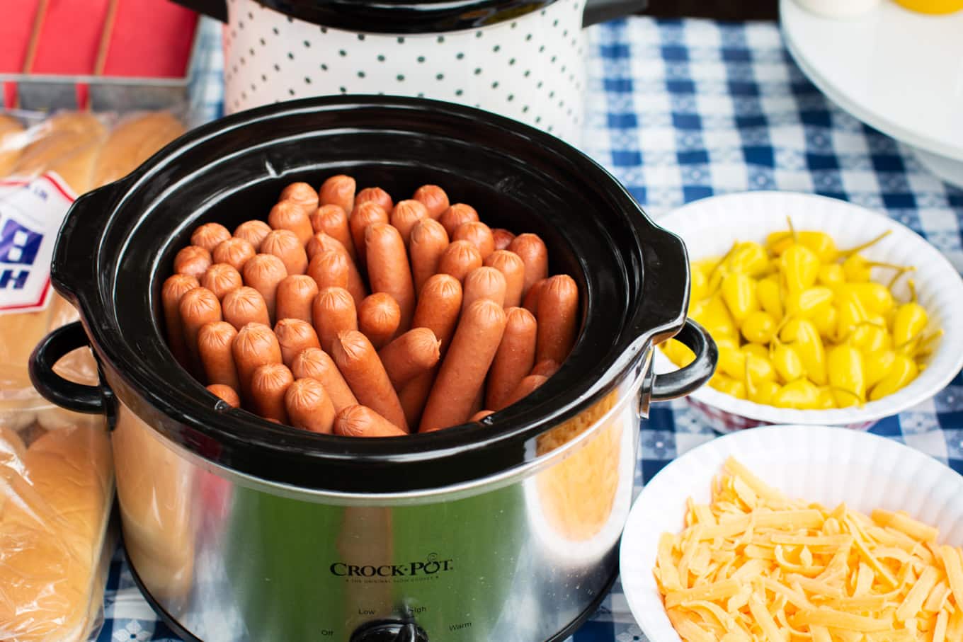 close up of hot dogs in a slow cooker.