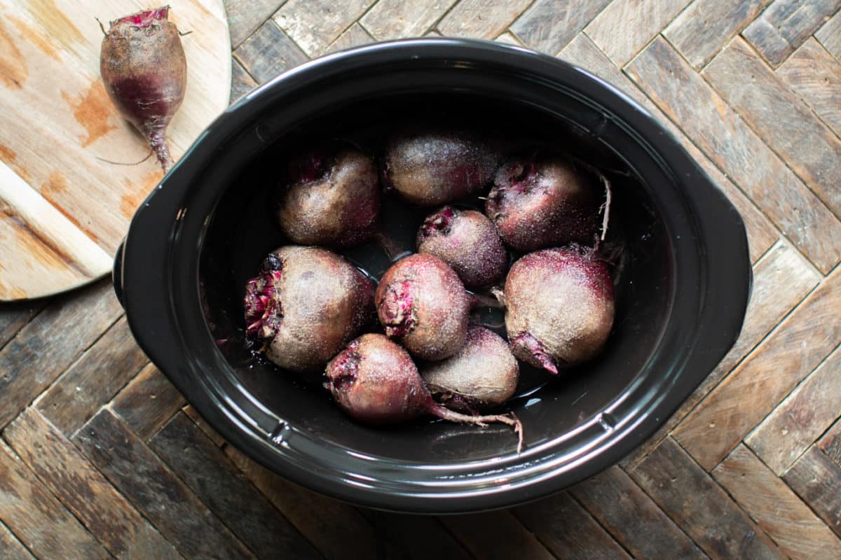 9 raw beets in a slow cooker.