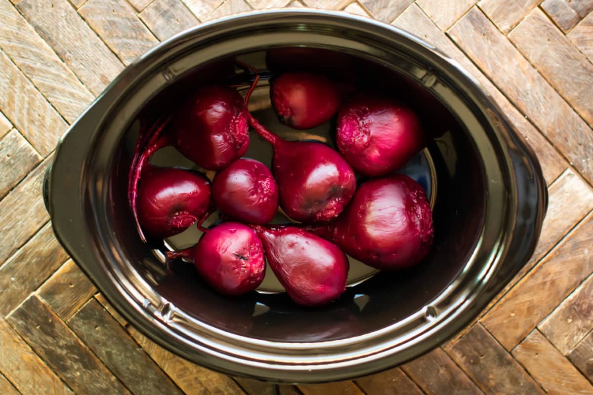 Cooked and peeled beets in the slow cooker.