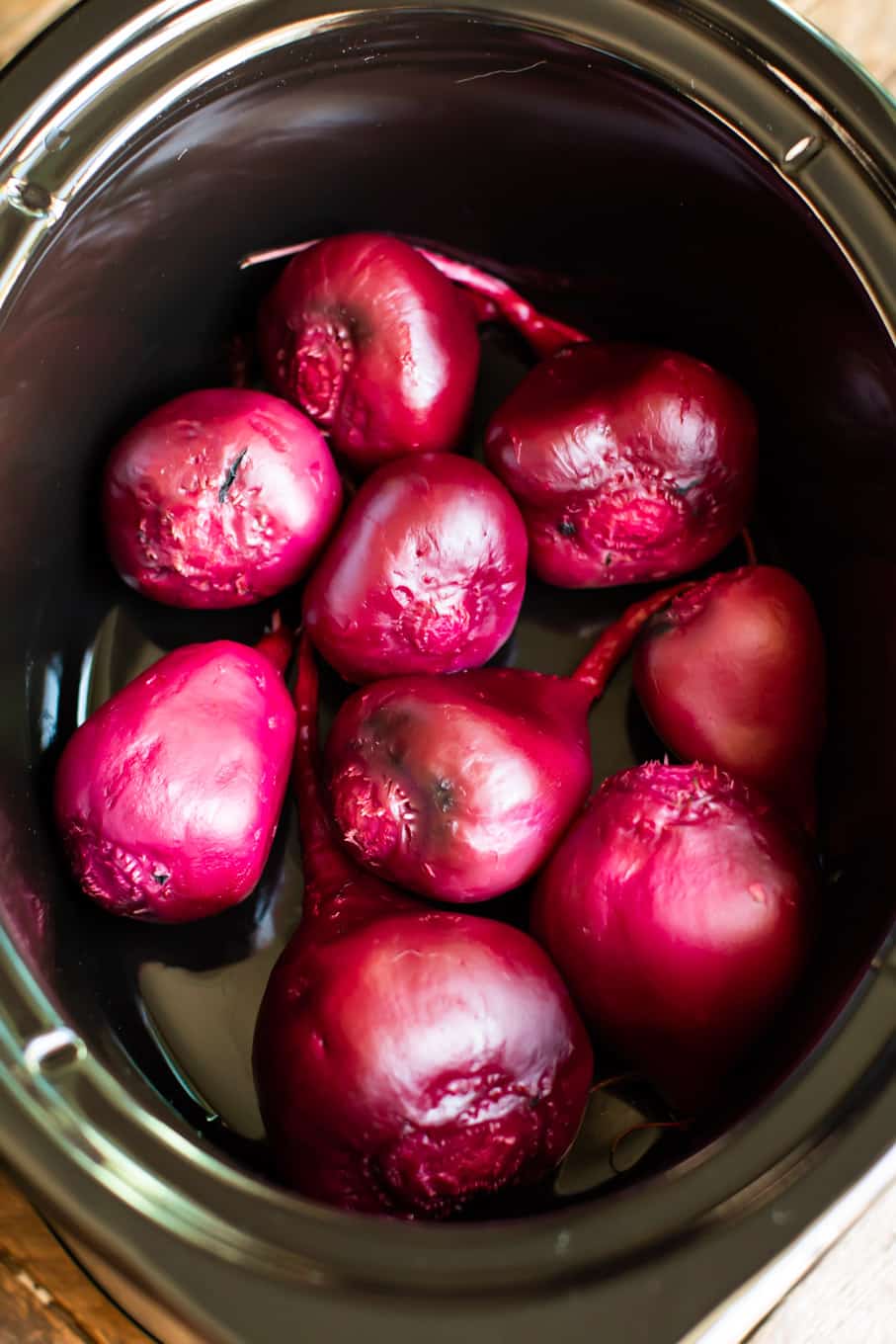 9 cooked and peeled beets in a slow cooker