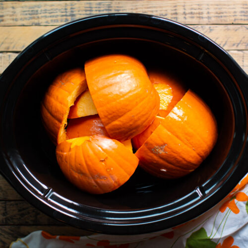 pumpkin pieces in the slow cooker.