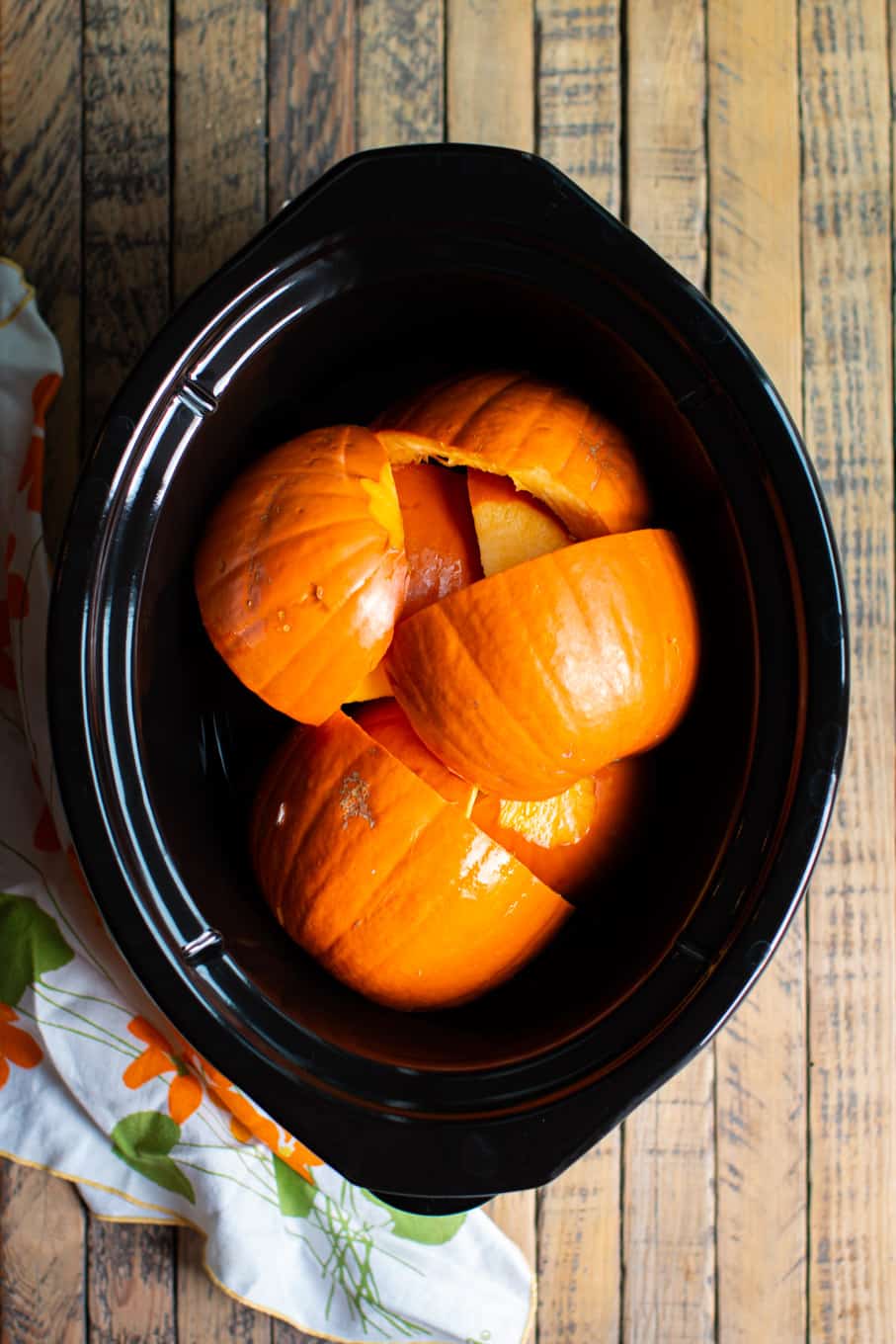 cut up pumpkin in the slow cooker.