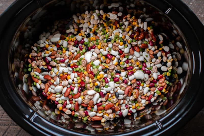 slow cooker with 15 bean types of beans in it.