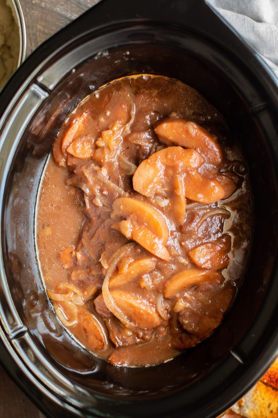 saucy apple butter pork chops in the slow cooker