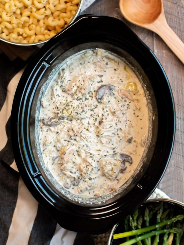 chicken in creamy mushroom sauce with noodles and asparagus on the side.