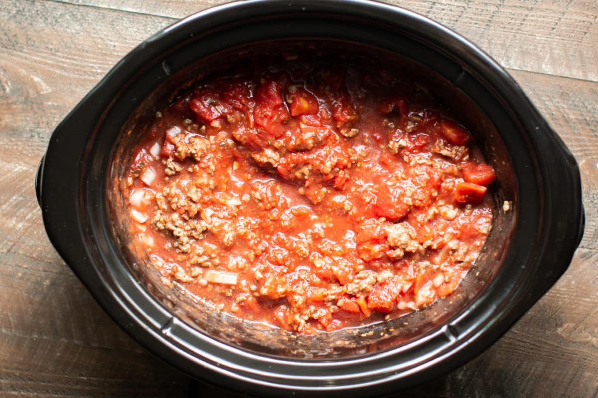 stirred uncooked spaghetti sauce in the slow cooker.