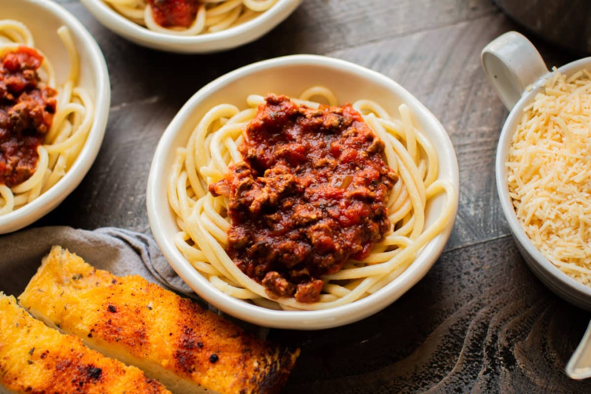 close up of a bowl of spaghetti and sauce.