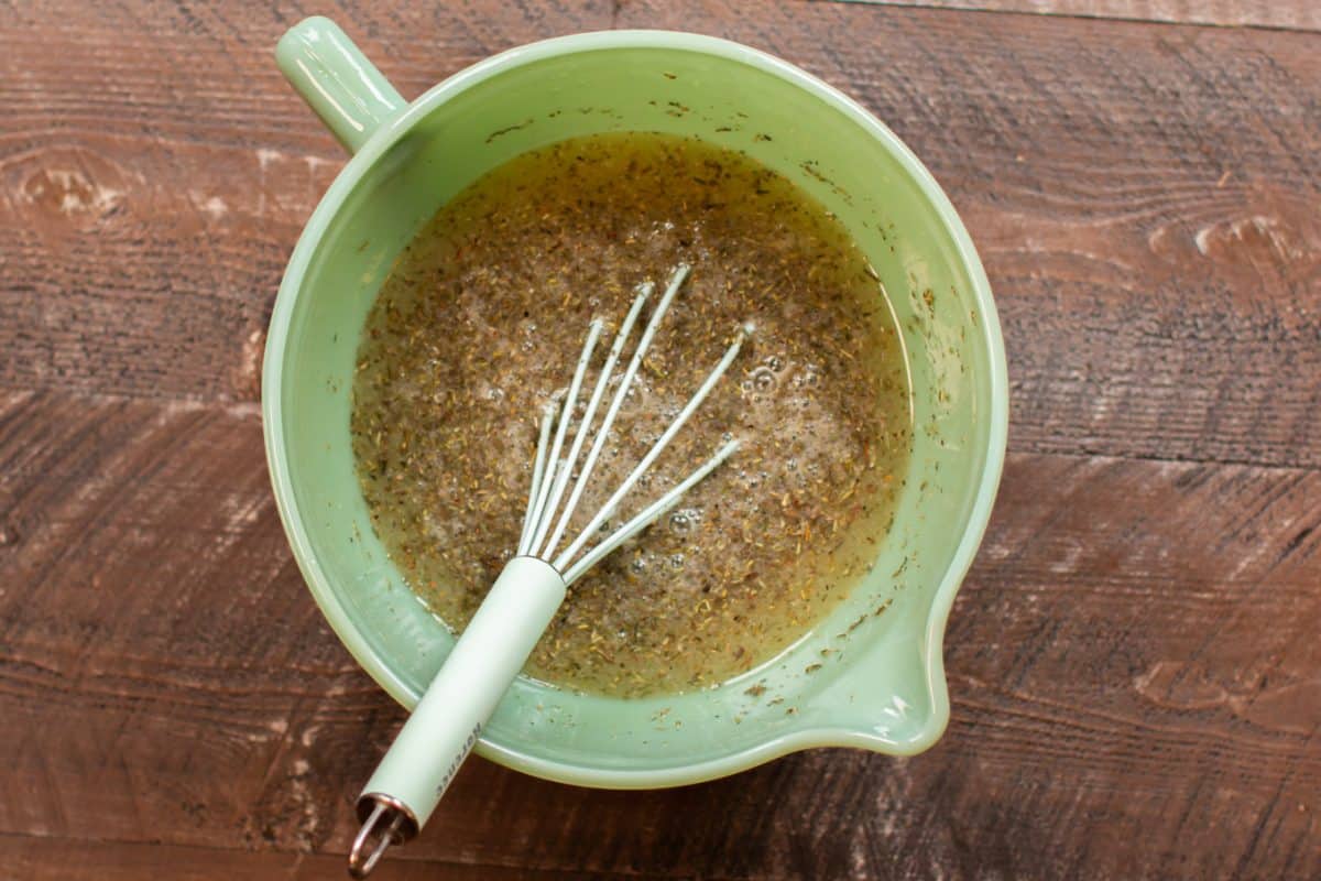 jadeite bowl with broth and seasonings in it.