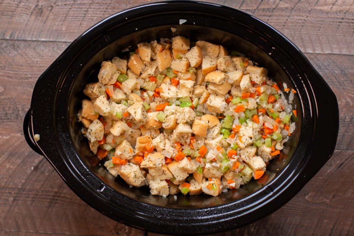uncooked mixed stuffing in a slow cooker