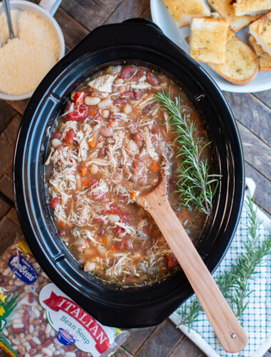 Multi bean soup in the slow cooker. Sprigs of rosemary on top.