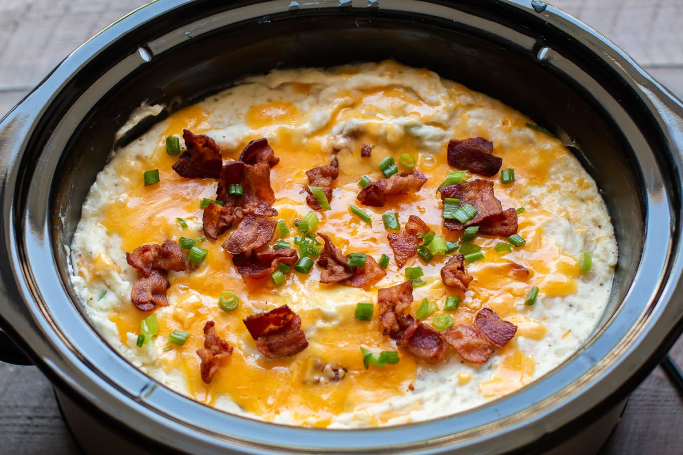 close up of baked potato casserole in slow cooker.