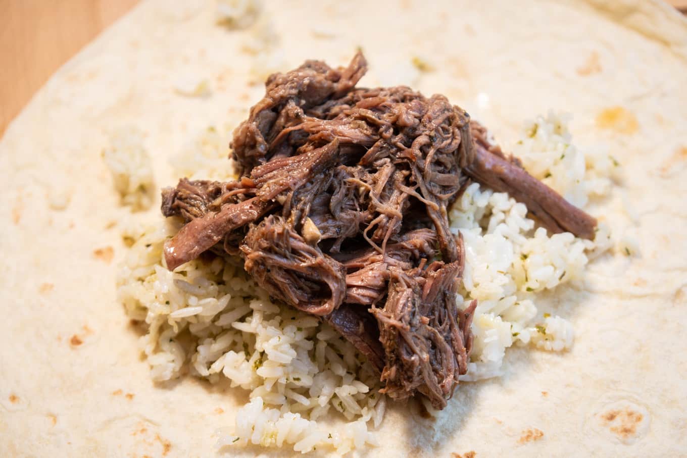 chipotle barbacoa meat on tortilla