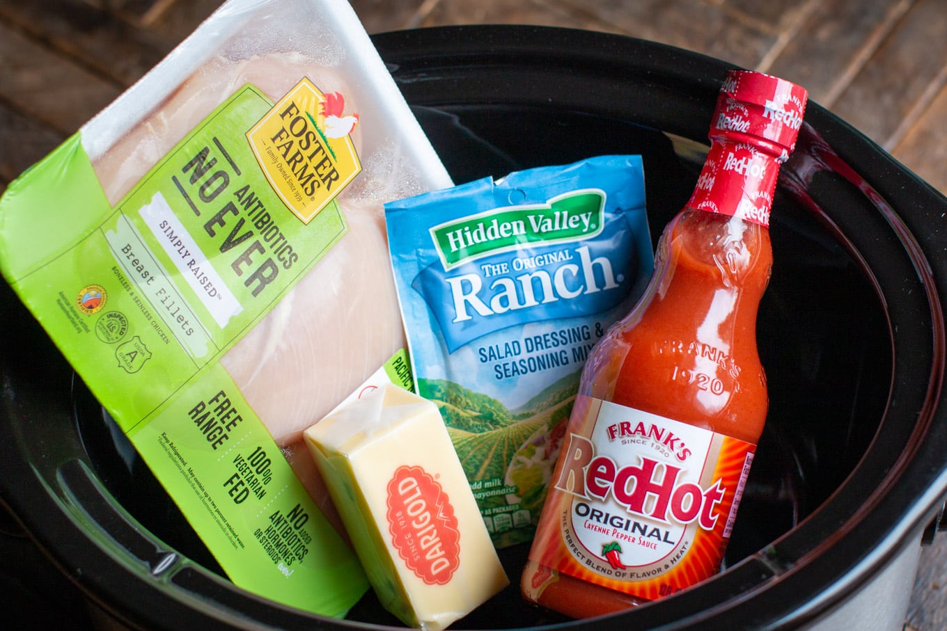 chicken breasts, ranch dressing mix, butter and bottle of buffalo sauce.