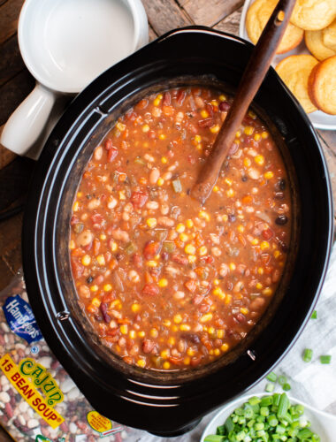 meatless 15 bean soup in slow cooker with spoon in it.