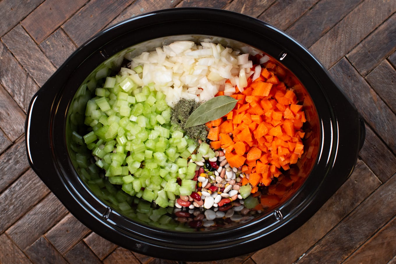 ingredients chopped in slow cooker for cajun vegetarian 15 bean soup