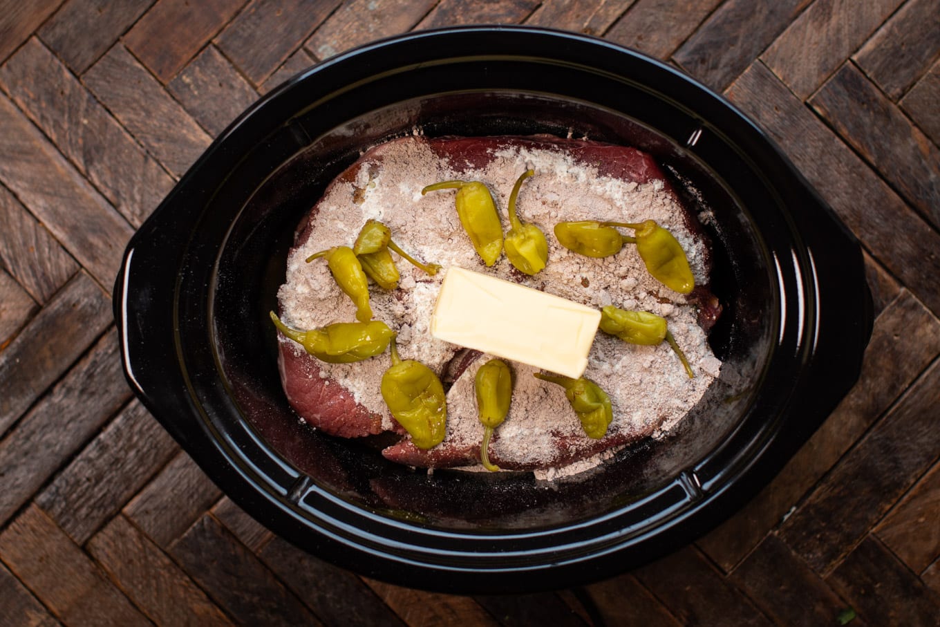 raw meat, with brown gravy packet, ranch dressing packet, peperoncini peppers and butter