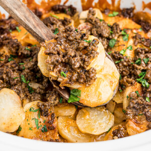 close up of beef and potatoes on a spatula.