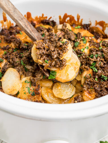 cooked beef and potatoes in a crockpot.