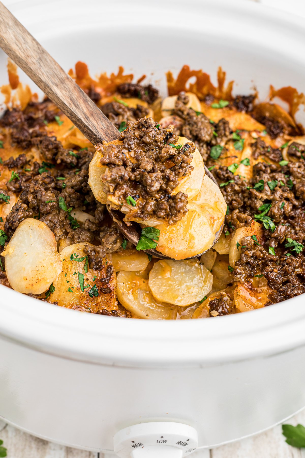 cooked beef and potatoes in a crockpot.