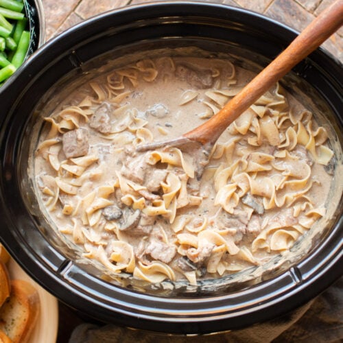 Beef stroganoff cooked with egg noodles in slow cooker.