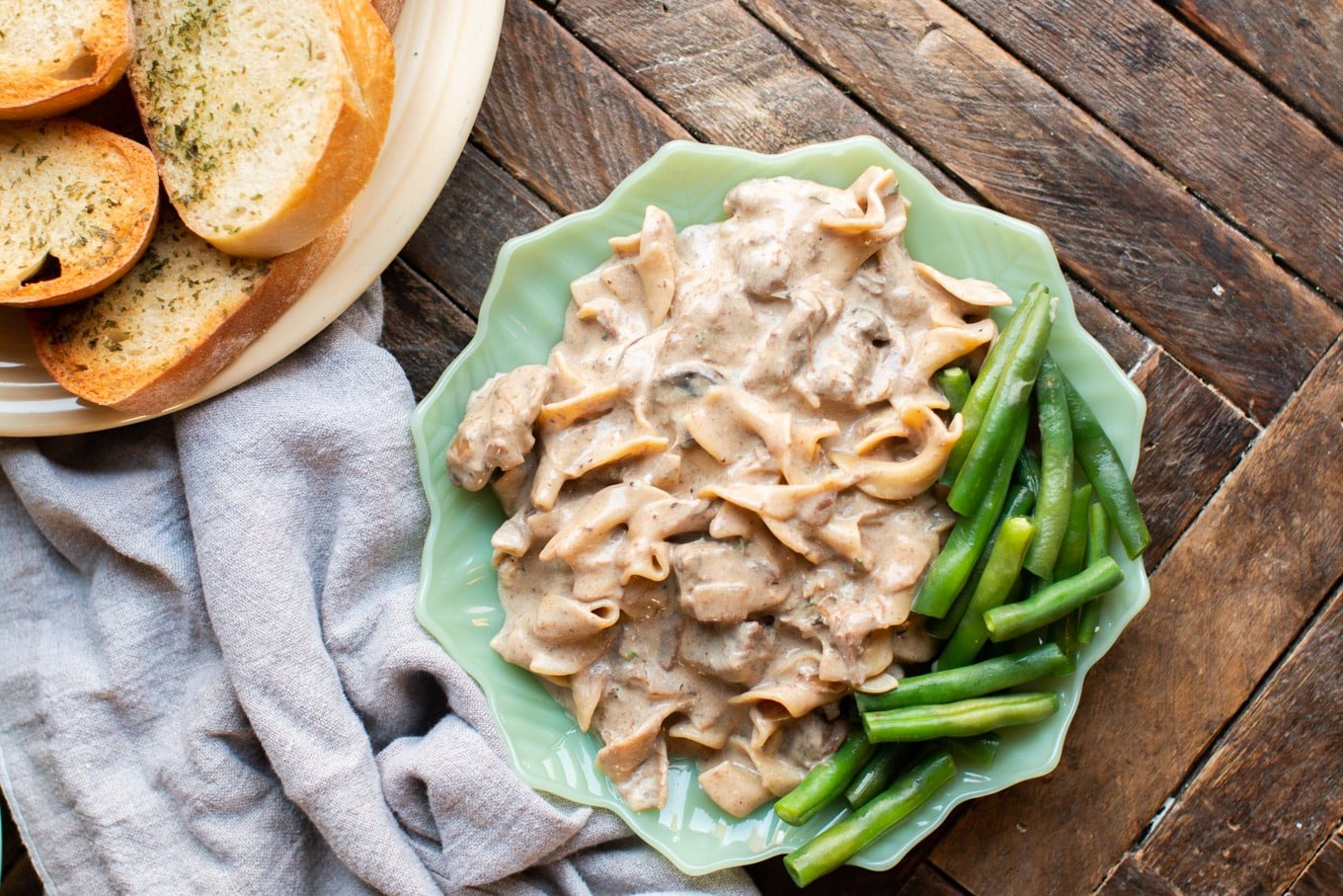 plated beef stroganoff on jadeite plate