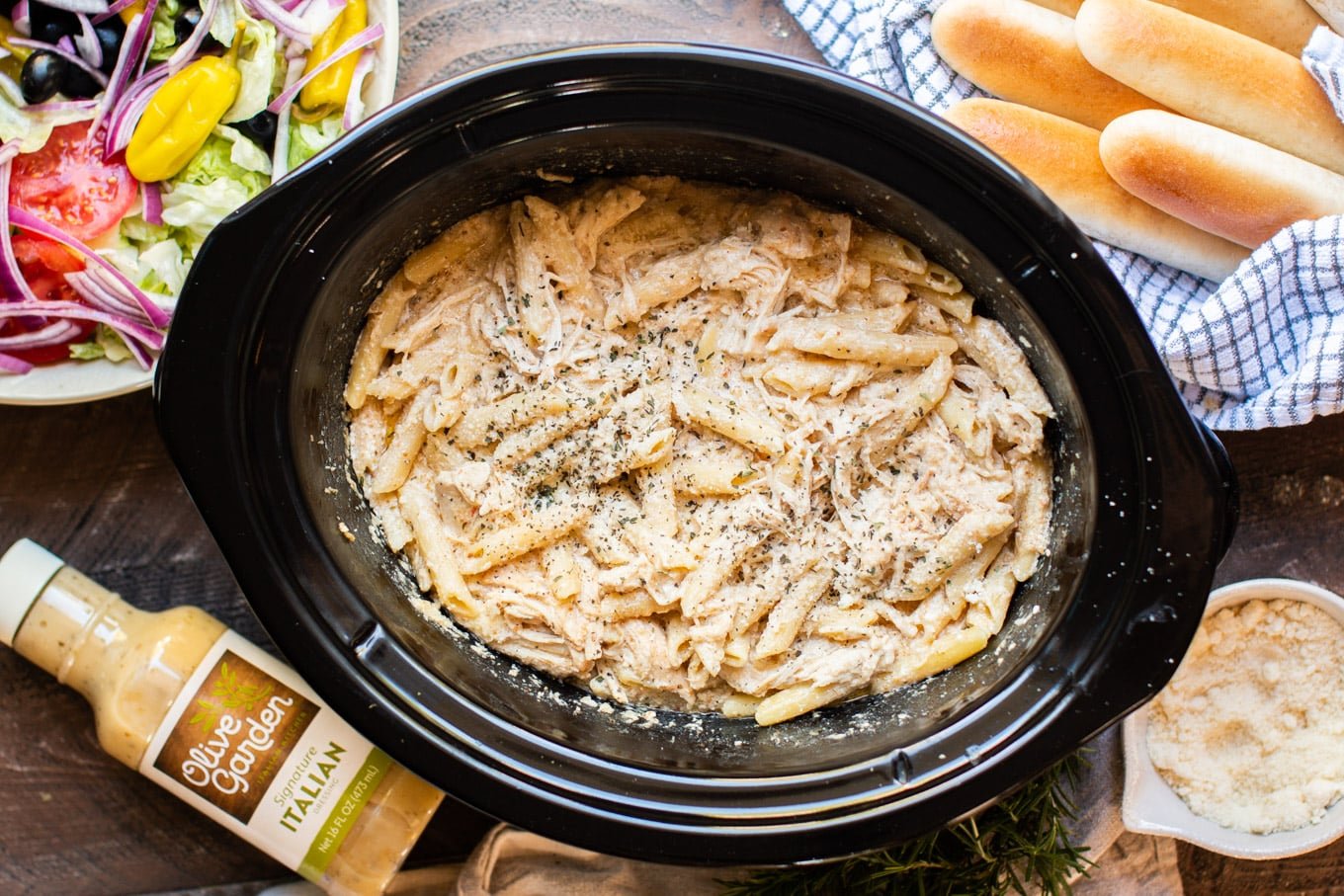 Chicken, pasta, in a creamy sauce served with bread sticks and salad