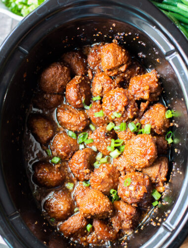 Close up of meatballs in teriyaki sauce in slow cooker