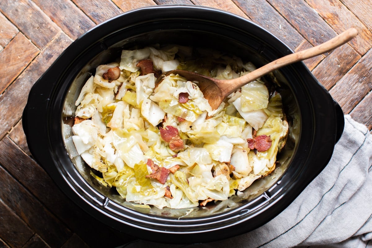 cut cooked cabbage with bacon in the slow cooker