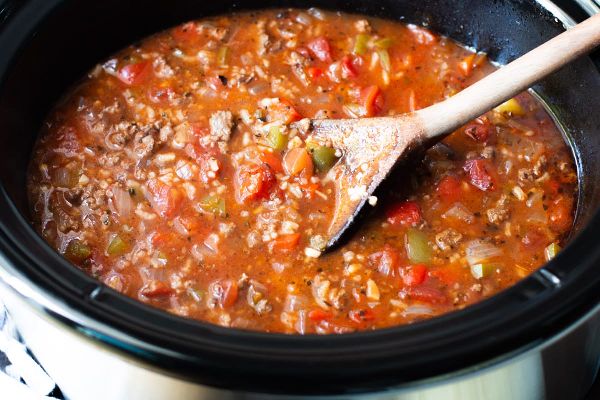 close up of beefy stuffed pepper soup in a slow cooker