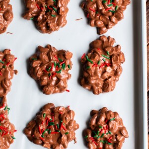 not yet set peanut clusters on a sheet pan