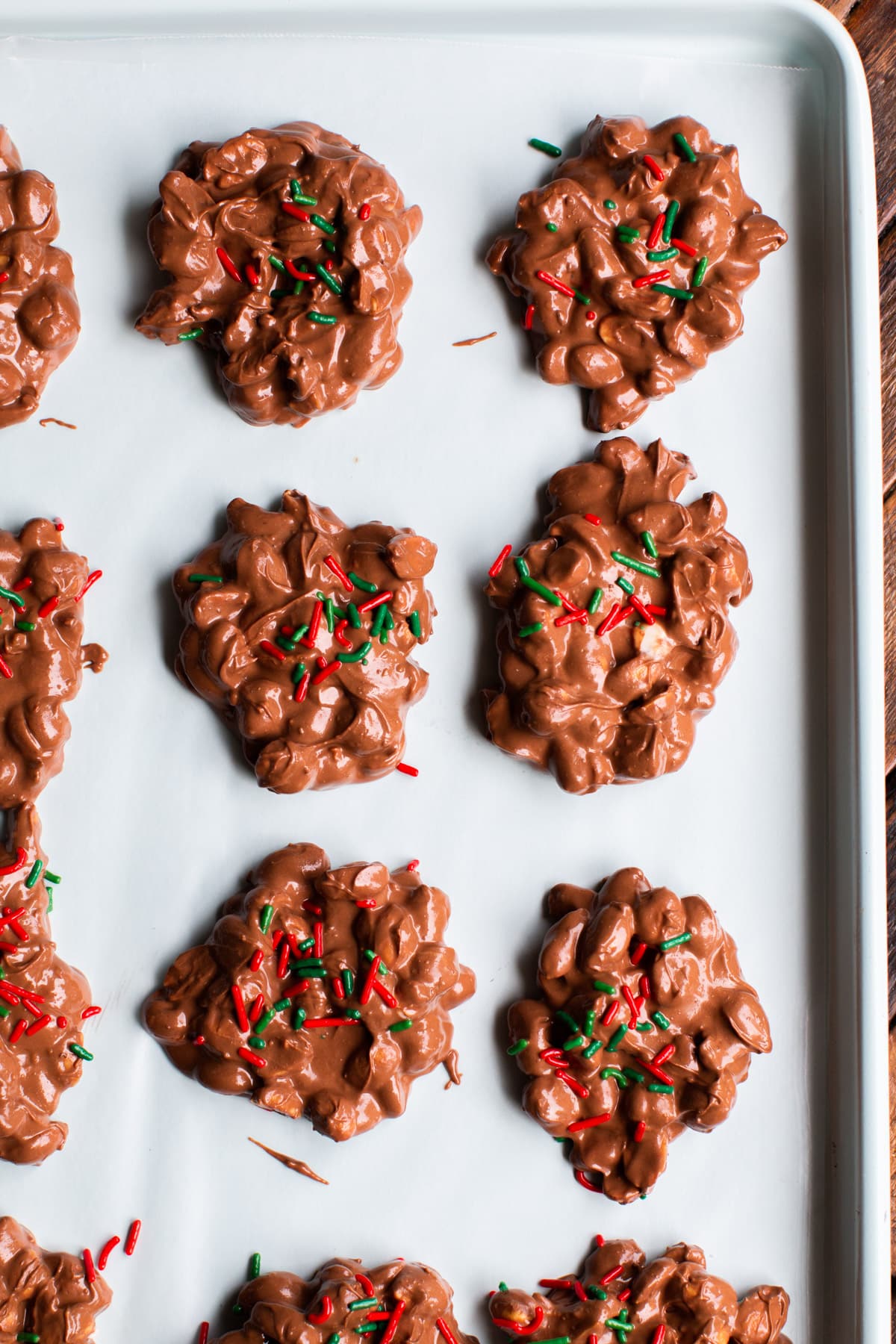 not yet set peanut clusters on a sheet pan