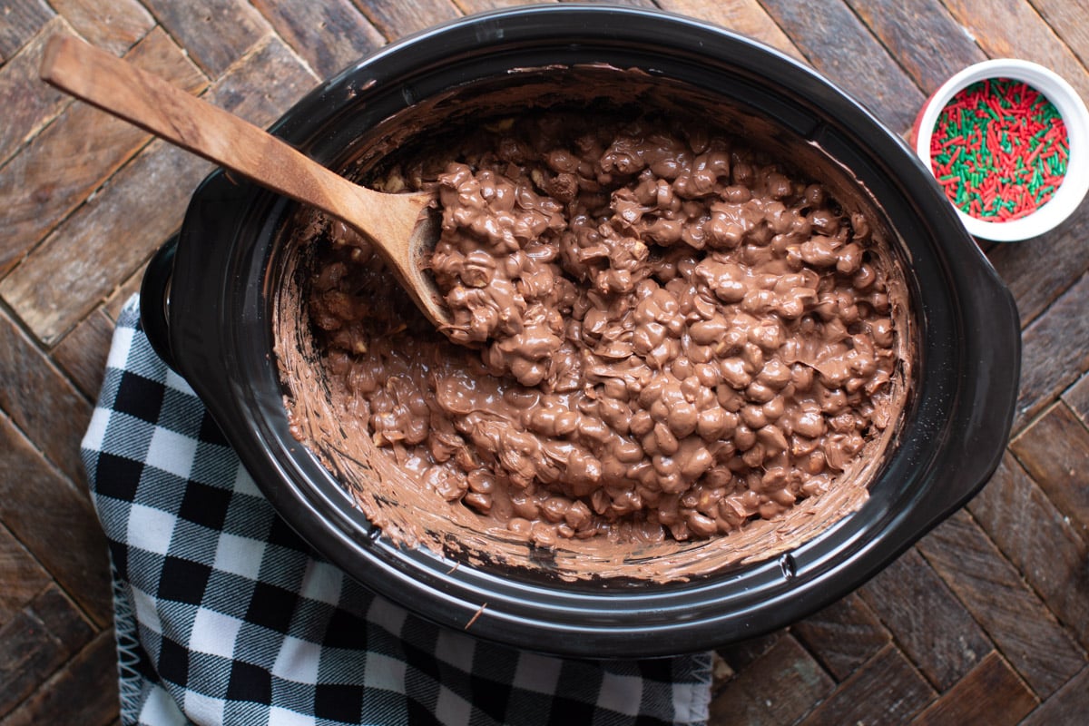 melted chocolate and peanuts in a slow cooker