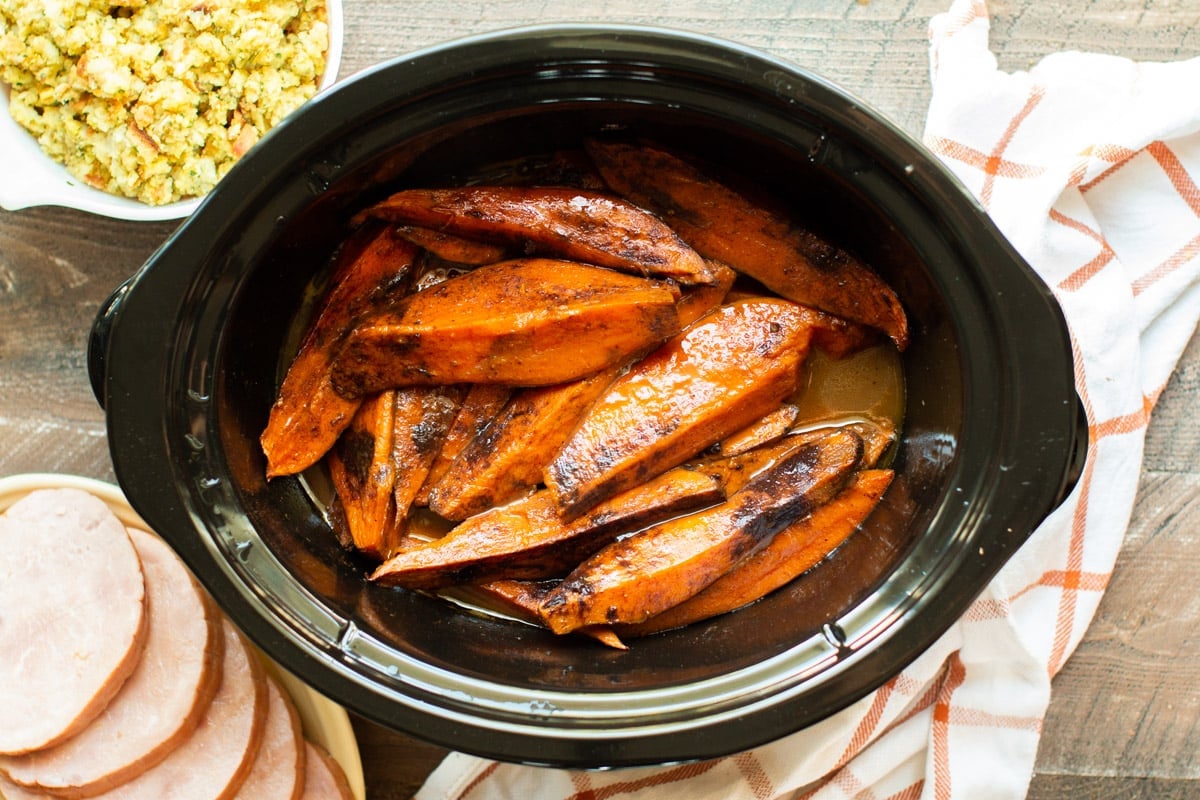 finished cooking sweet potato wedges with cinnamon on top.