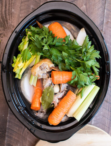 veggies, turkey and water in slow cooker