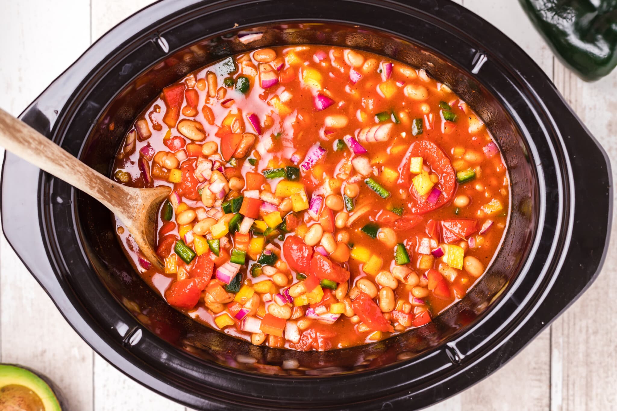 vegetarian chili in slow cooker before being cooked.