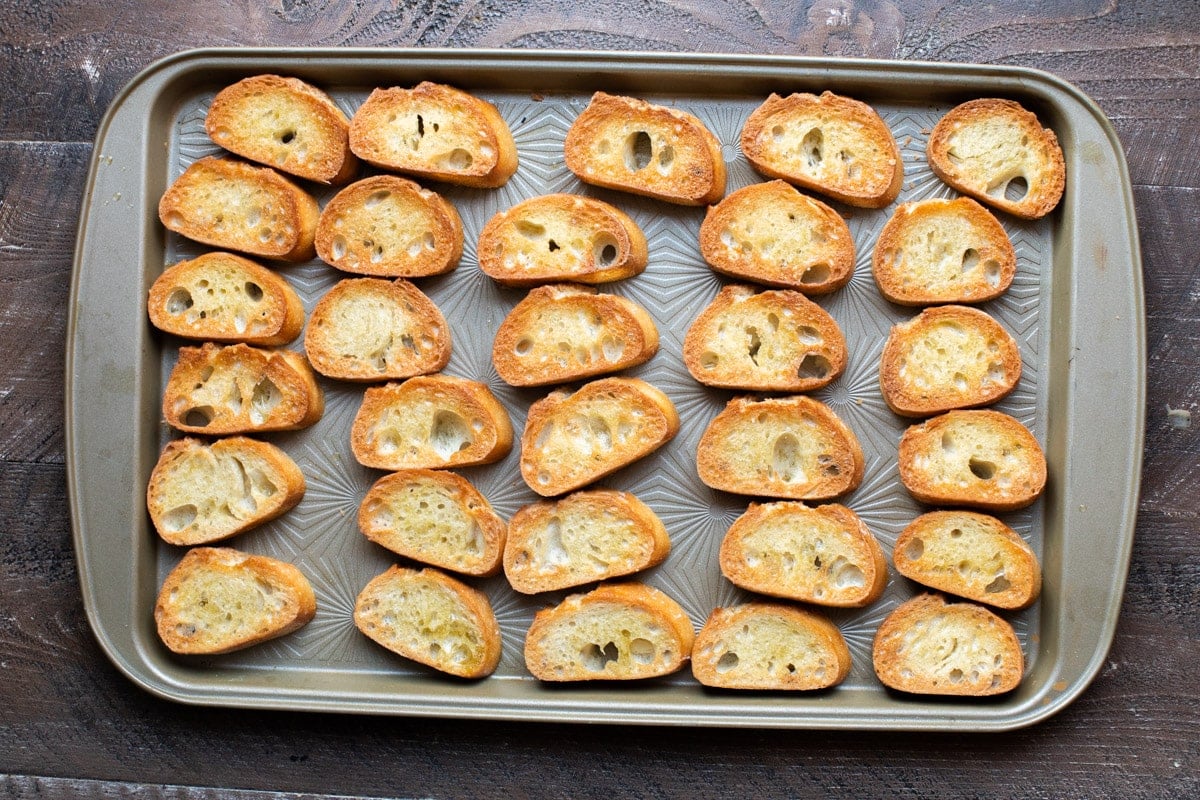 sliced bread that is toasted on tray