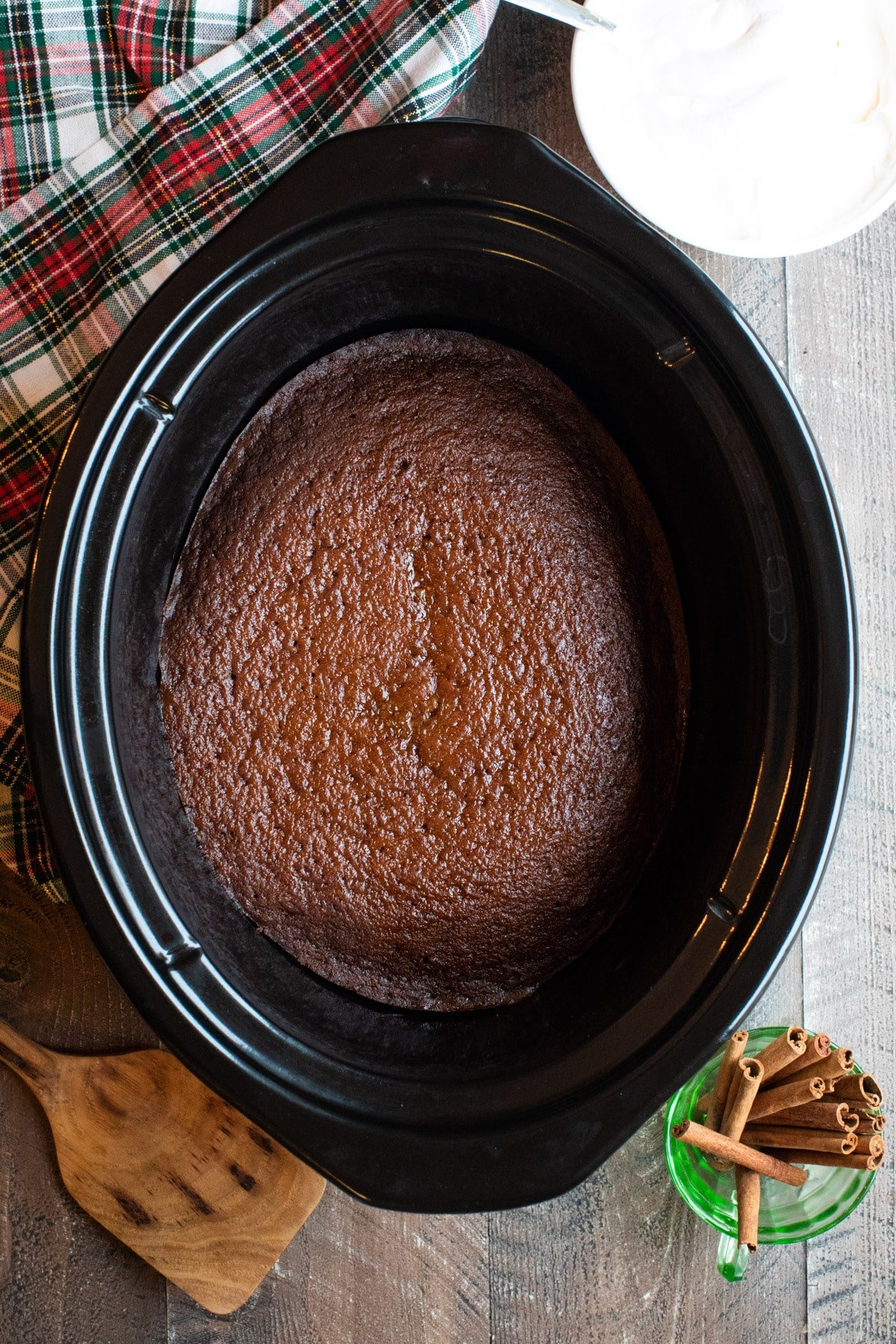 close up of cooked gingerbread cake in slow cooker