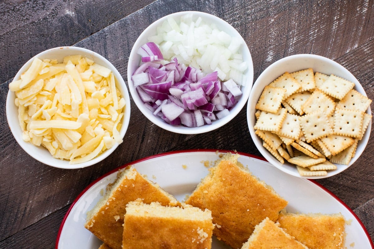 bowl of cheese, onion and crackers. Platter of cornbread.