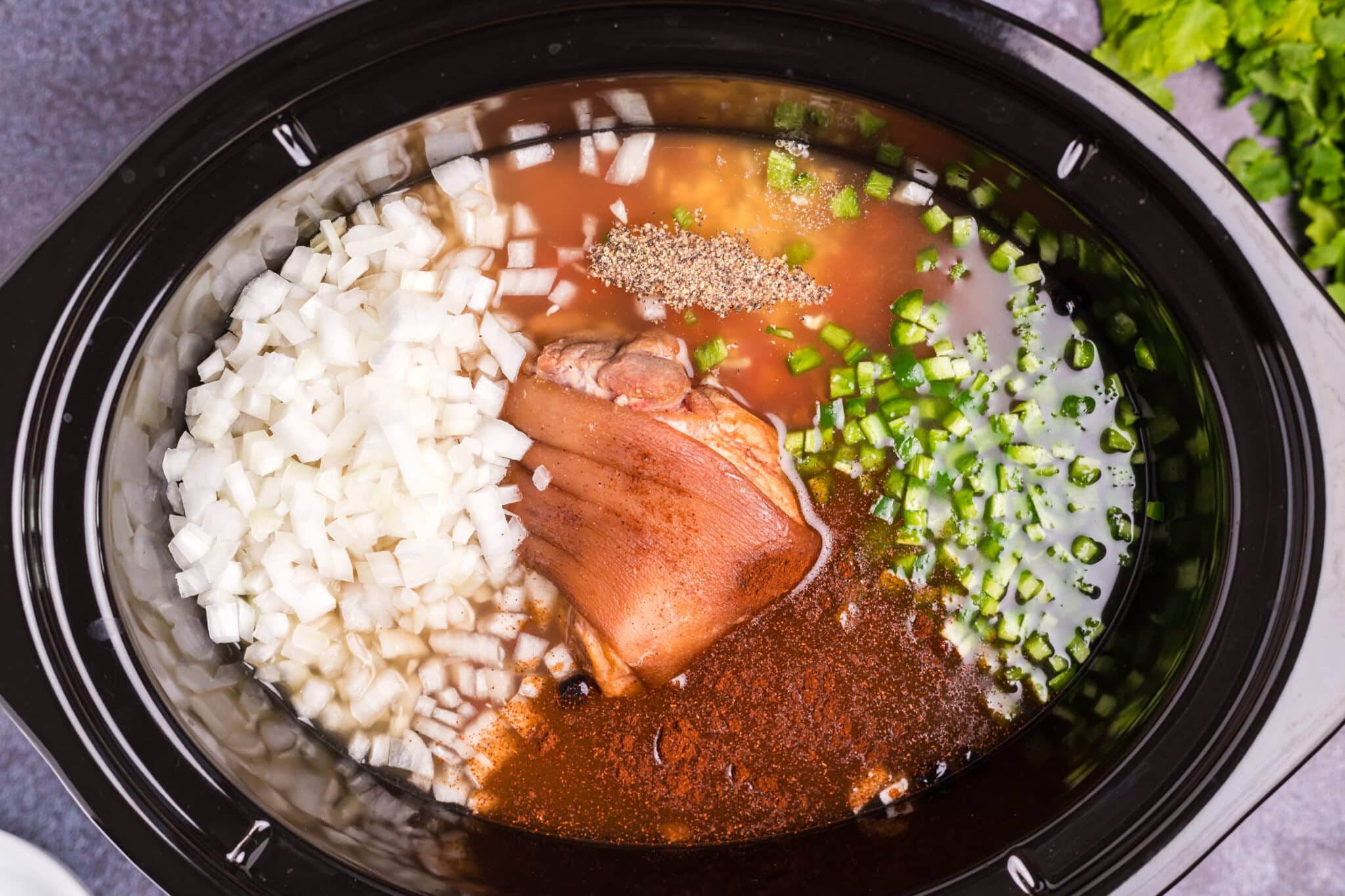 ham hock, beans, vegetables, and chicken broth in slow cooker