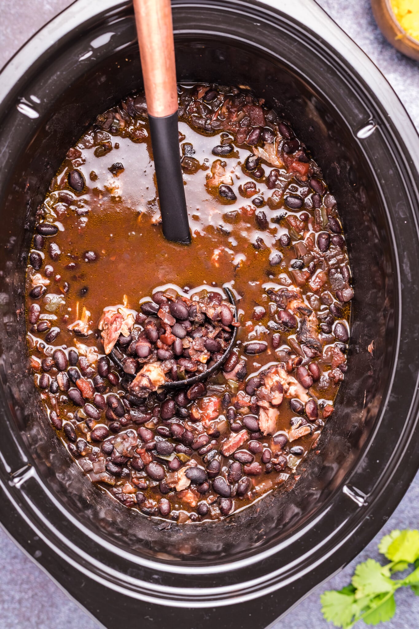 close up of black bean soup in slow cooker