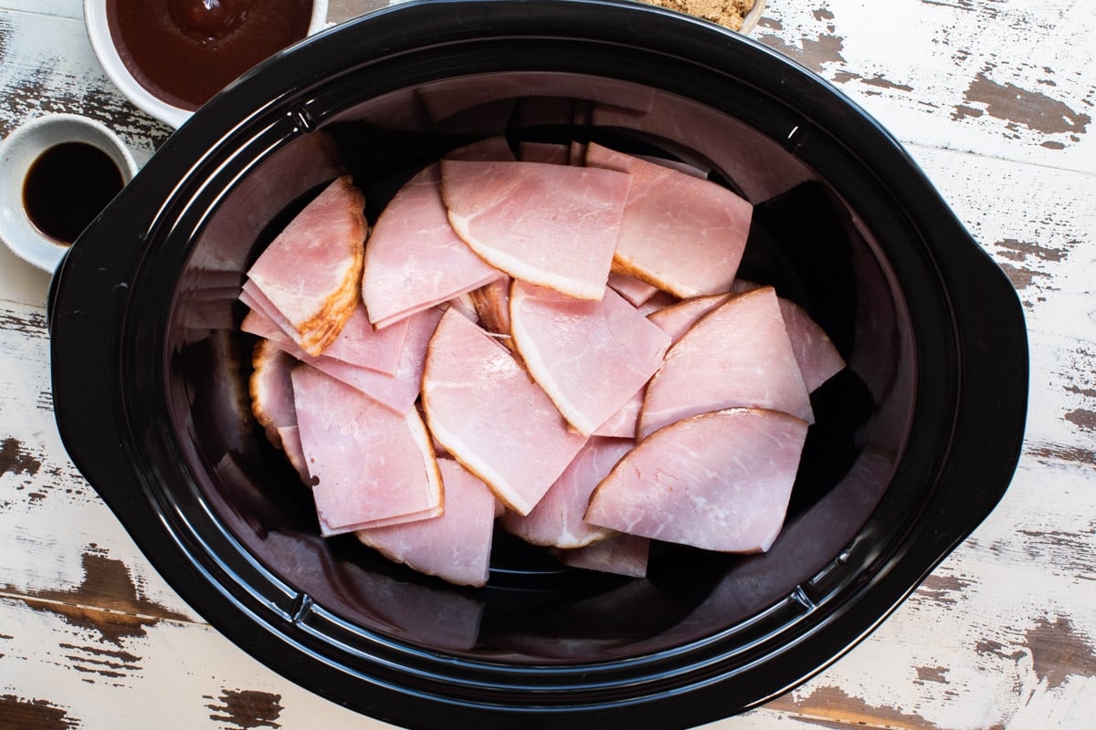 slices of ham in slow cooker