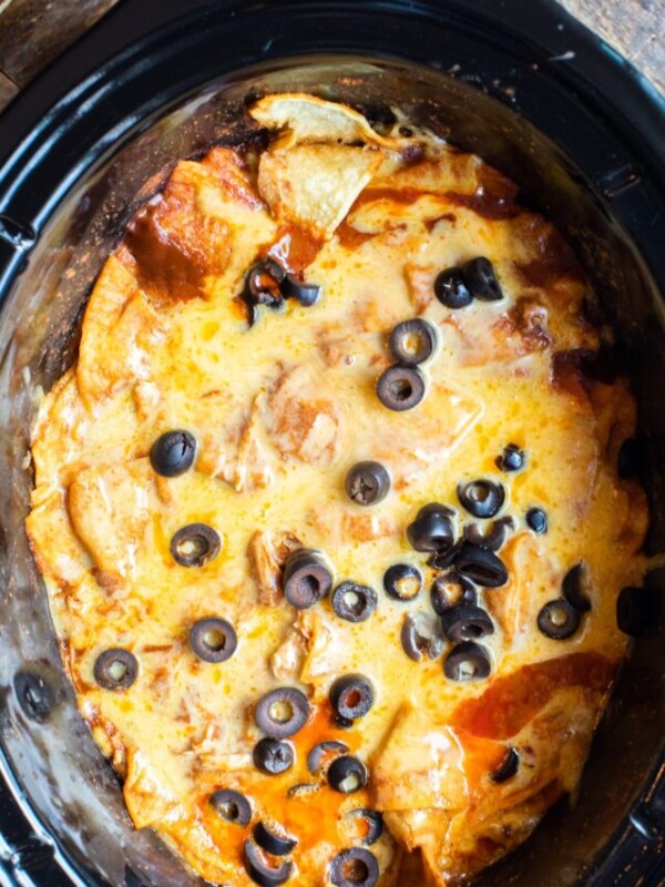 Enchilada casserole with cheese and olives in the slow cooker.