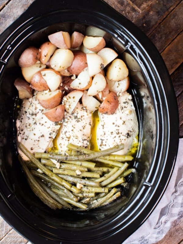 seasoned chicken, potatoes and green beans in the slow cooker.